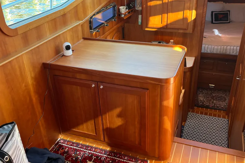 Slide: The Image of Interior of 2006 Sabre 36 Flybridge Sedan with wooden cabinetry and cozy bedroom. - 26