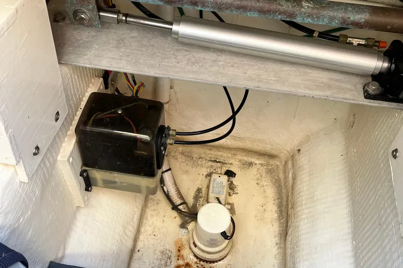 Slide: The Image of Engine compartment of 2006 Sabre 36 Flybridge Sedan with hydraulic components and wiring. - 42