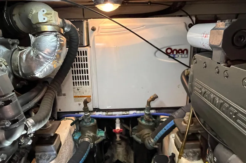 Slide: The Image of Engine room of 2006 Sabre 36 Flybridge Sedan with Onan generator and Yanmar engine. - 45
