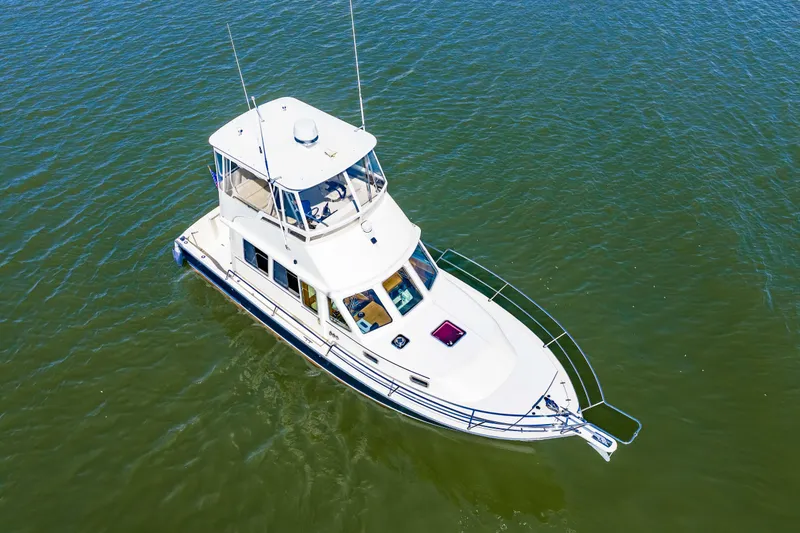 Slide: The Image of Aerial view of 2006 Sabreline 36 Fly yacht on calm water. - 51