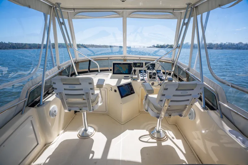 Slide: The Image of Interior view of 2006 Sabreline 36 Flybridge yacht with dual helm seats and navigation equipment. - 61