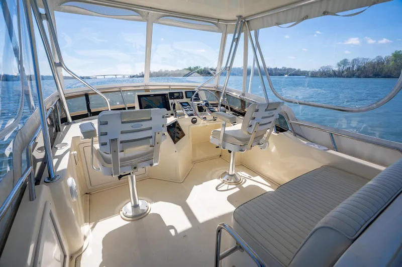 Slide: The Image of Interior view of 2006 Sabreline 36 Flybridge yacht with helm and seating. - 63