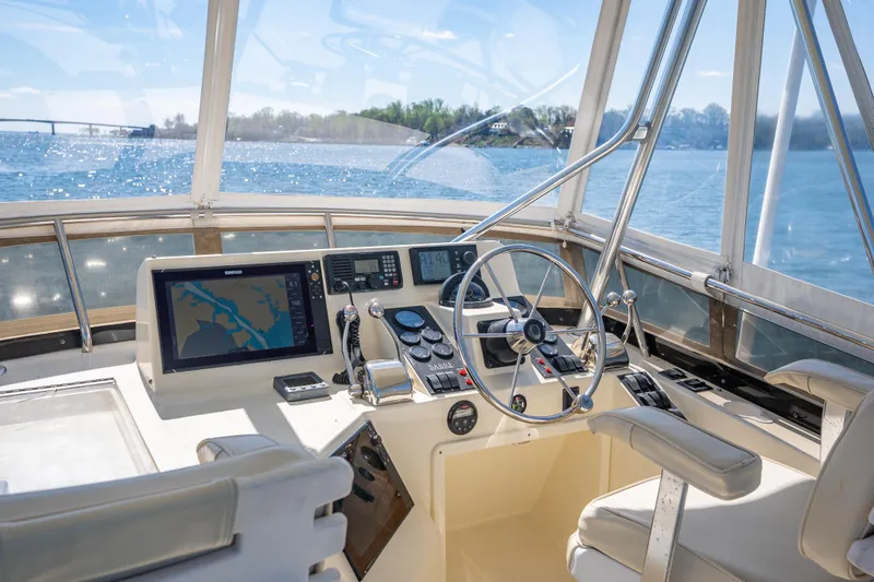 Slide: The Image of Helm of 2006 Sabreline 36 Fly yacht with navigation equipment and scenic water view. - 64