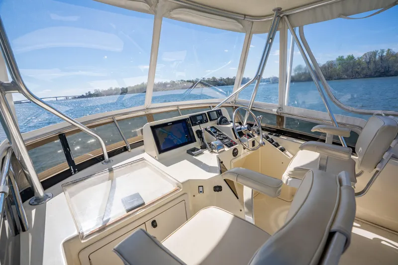 Slide: The Image of Flybridge of 2006 Sabreline 36 Fly yacht with navigation equipment and scenic water view. - 65