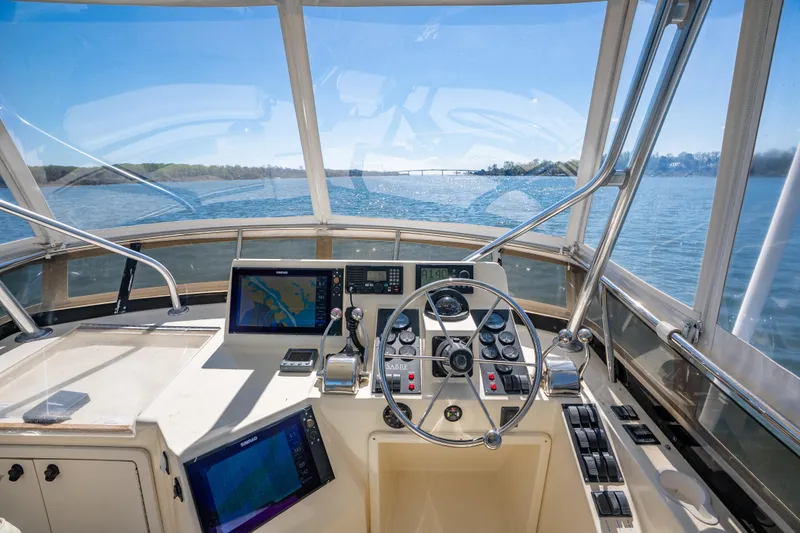 Slide: The Image of Cockpit view of 2006 Sabreline 36 Fly yacht, featuring navigation equipment and steering wheel. - 66