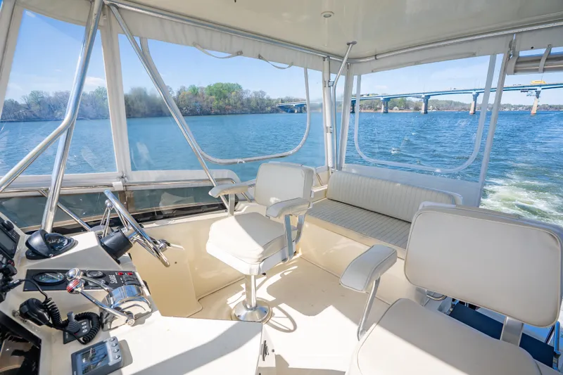 Slide: The Image of 2006 Sabreline 36 Flybridge interior with scenic water view and comfortable seating. - 68