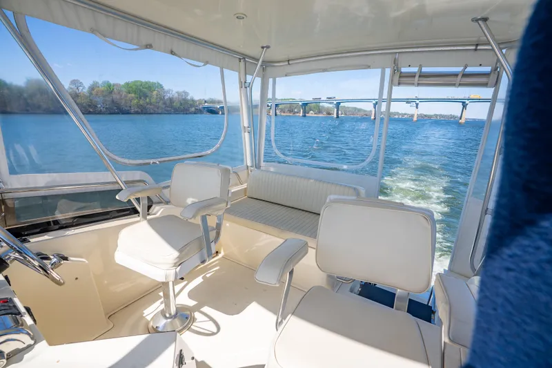 Slide: The Image of Interior view of 2006 Sabreline 36 Fly yacht with scenic water and bridge backdrop. - 69