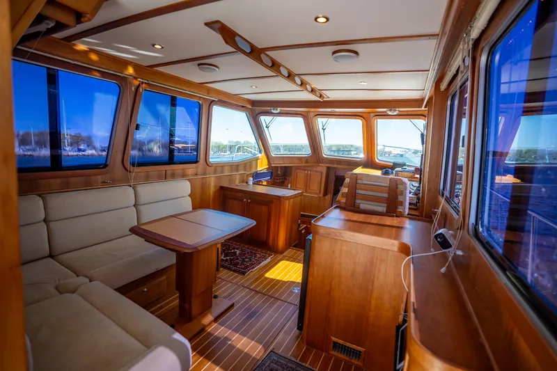 Slide: The Image of Luxurious interior of 2006 Sabreline 36 Fly yacht with wooden finishes and seating area. - 72