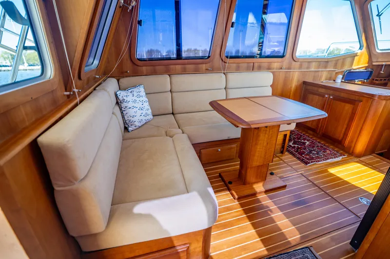 Slide: The Image of Luxurious interior of 2006 Sabreline 36 Fly yacht with wood finish and cozy seating. - 73