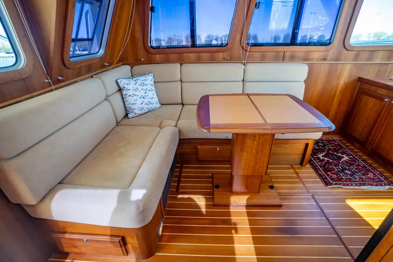 Slide: The Image of Interior of 2006 Sabreline 36 Fly yacht with cozy seating and wooden table. - 74