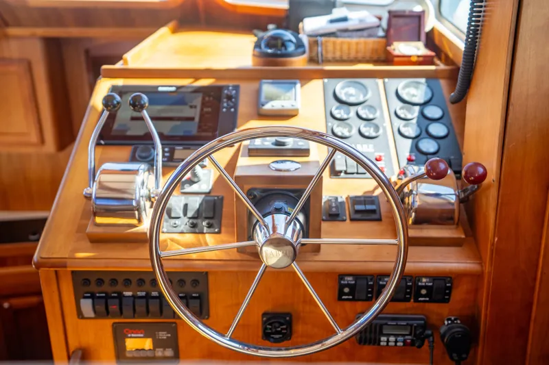 Slide: The Image of Helm of 2006 Sabreline 36 Fly with steering wheel and control panel. - 78