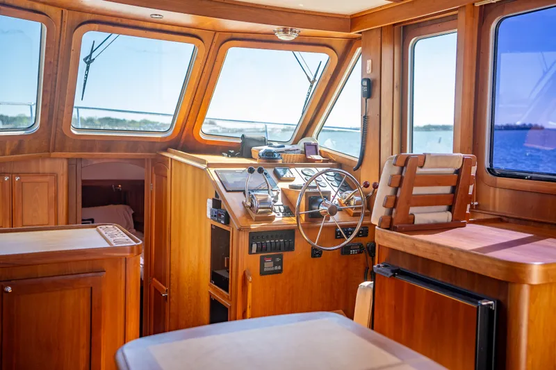 Slide: The Image of Interior of 2006 Sabreline 36 Fly yacht with wooden helm and panoramic windows. - 81