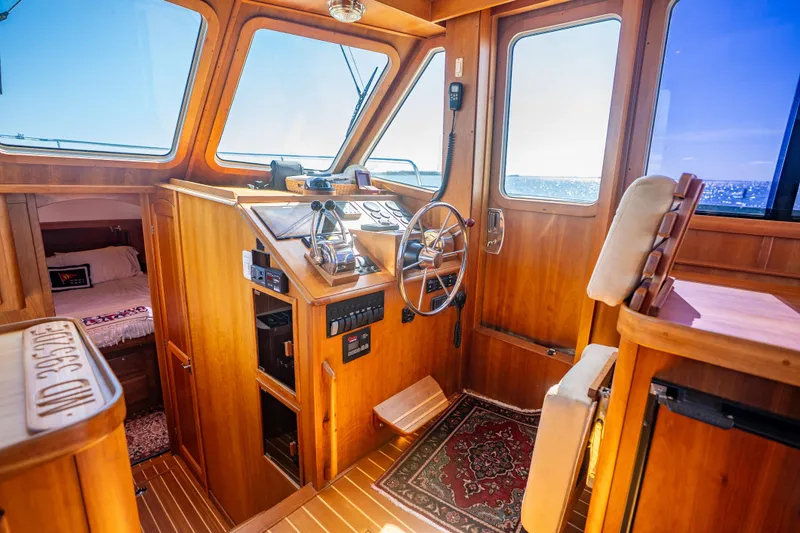 Slide: The Image of Interior of 2006 Sabreline 36 Fly yacht with wooden helm and cozy cabin. - 83
