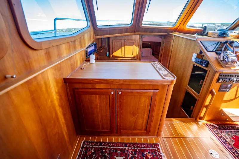 Slide: The Image of Interior of 2006 Sabreline 36 Fly yacht with wooden cabinetry and panoramic windows. - 87