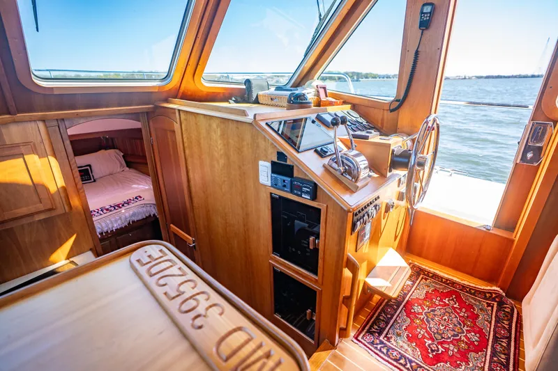 Slide: The Image of Interior of 2006 Sabreline 36 Fly yacht with wooden helm and cozy cabin. - 88