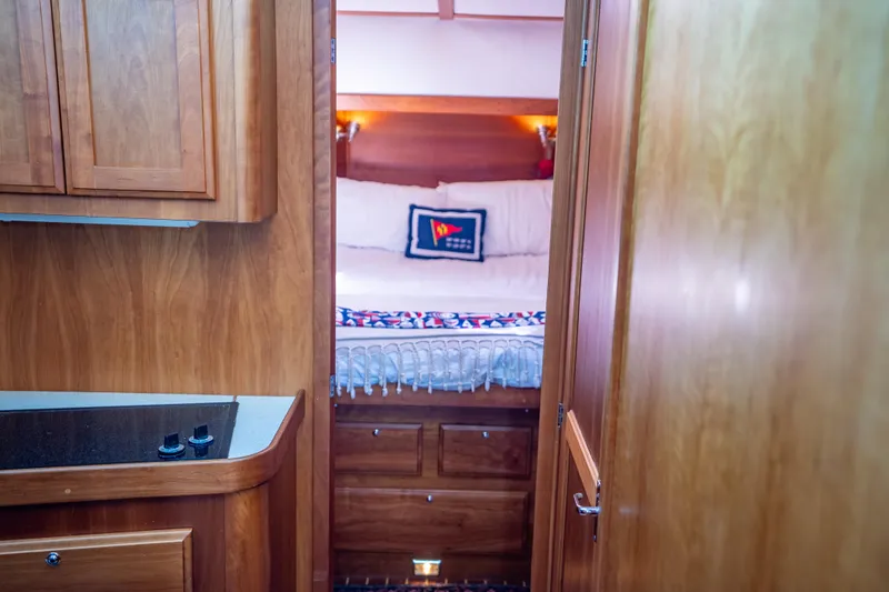 Slide: The Image of Cozy cabin interior of 2006 Sabreline 36 Fly yacht with wooden finishes. - 90