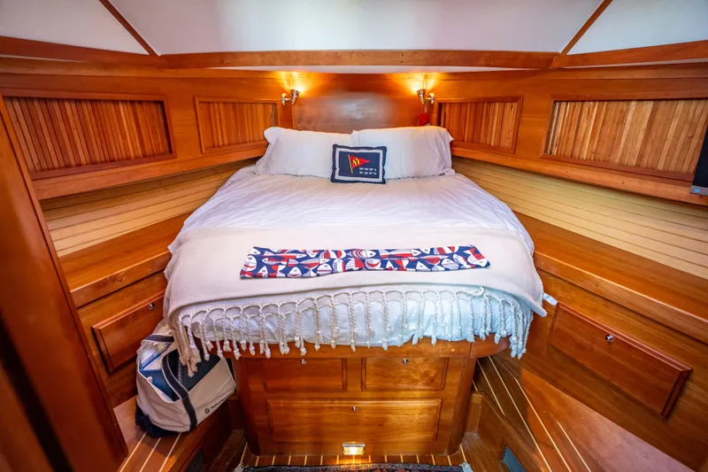 Slide: The Image of Cozy cabin interior of 2006 Sabreline 36 Fly yacht with wooden finish and comfortable bedding. - 96