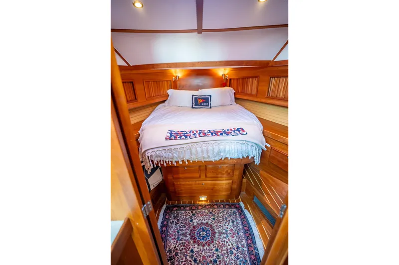 Slide: The Image of Cozy cabin interior of 2006 Sabreline 36 Fly yacht with wooden finish and bed. - 97