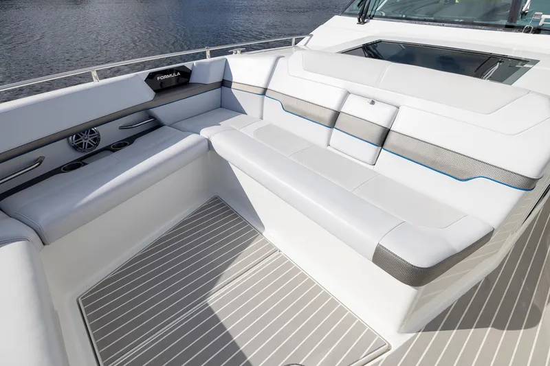 Slide: The Image of 2019 Formula 430 Super Sport Crossover boat interior with sleek seating and modern design. - 14