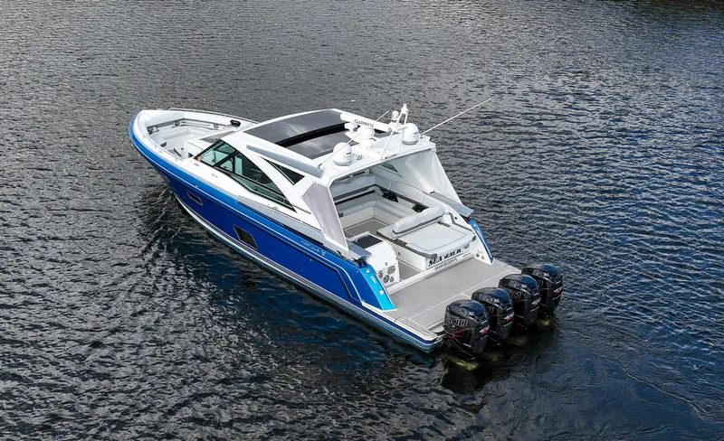 Slide: The Image of 2019 Formula 430 Super Sport Crossover boat on water, featuring sleek design and powerful engines. - 2