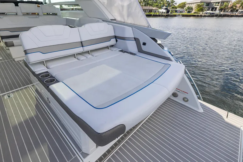 Slide: The Image of 2019 Formula 430 Super Sport Crossover boat with luxurious seating on deck. - 6
