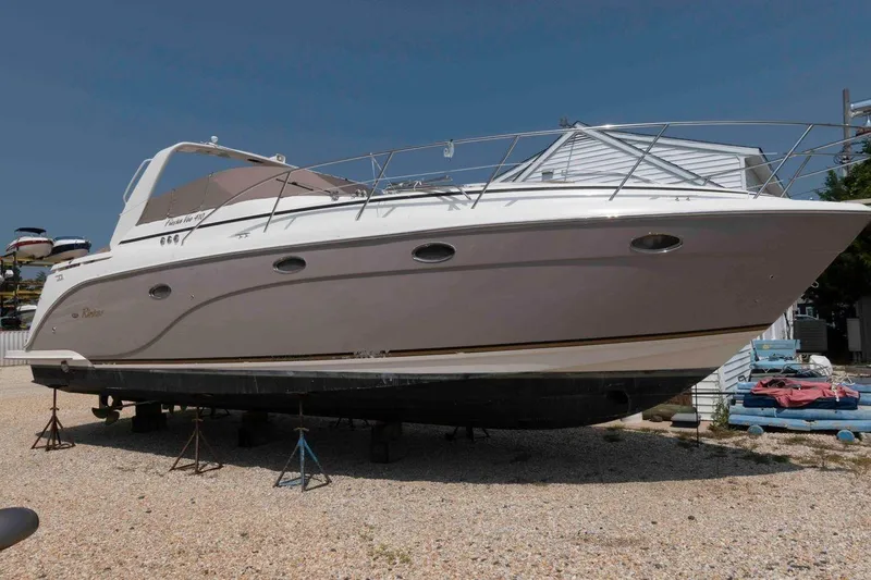 The Image of 2006 Rinker Fiesta Vee 410 yacht on dry dock, side view. - 0