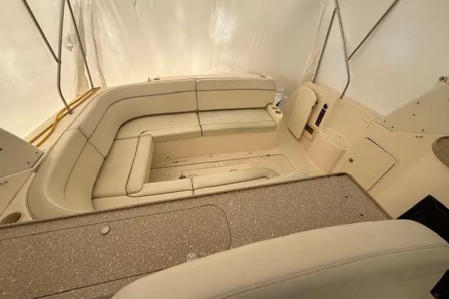 Slide: The Image of 2006 Rinker Fiesta Vee 410 boat interior with beige seating and spacious layout. - 25