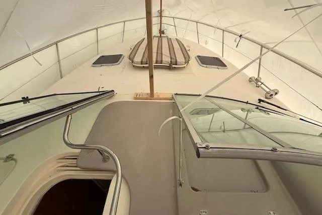 Slide: The Image of 2006 Rinker Fiesta Vee 410 boat interior with open hatch and windows. - 27