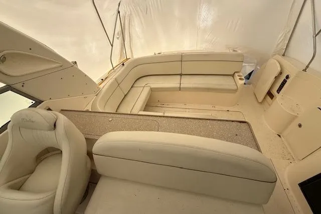 Slide: The Image of 2006 Rinker Fiesta Vee 410 boat interior with beige seating and helm. - 30