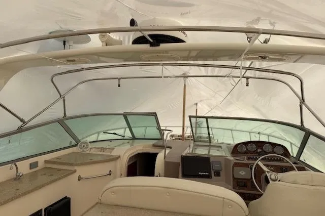 Slide: The Image of 2006 Rinker Fiesta Vee 410 boat interior with helm and dashboard. - 35