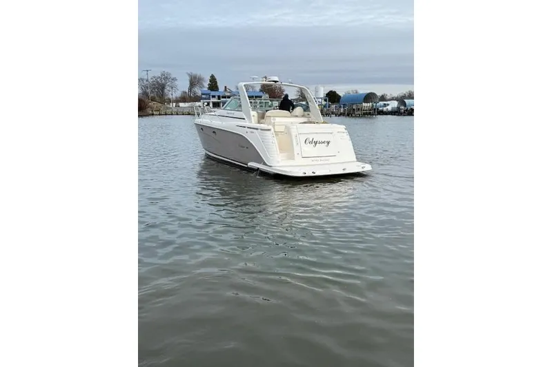 Slide: The Image of 2006 Rinker Fiesta Vee 410 boat on calm water, rear view. - 4