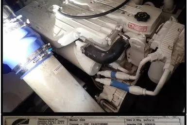 Slide: The Image of Engine compartment of 2006 Rinker Fiesta Vee 410 boat with visible components and labels. - 41