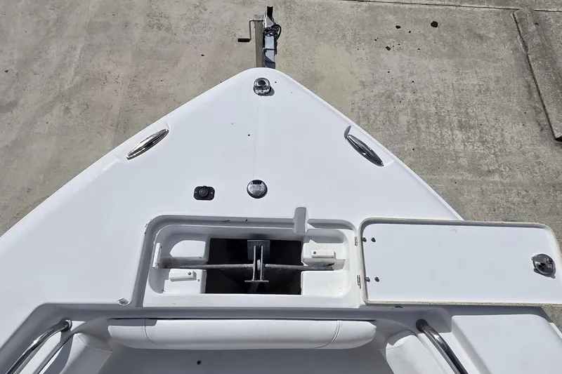 Slide: The Image of Bow view of 2017 Sea Hunt Ultra 225 boat with anchor storage. - 11