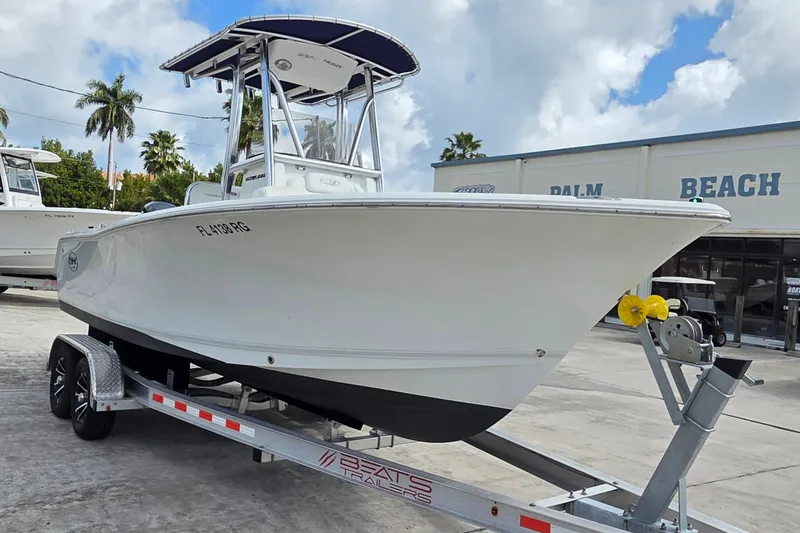 Slide: The Image of 2017 Sea Hunt Ultra 225 boat on trailer, parked at Palm Beach dealership. - 3