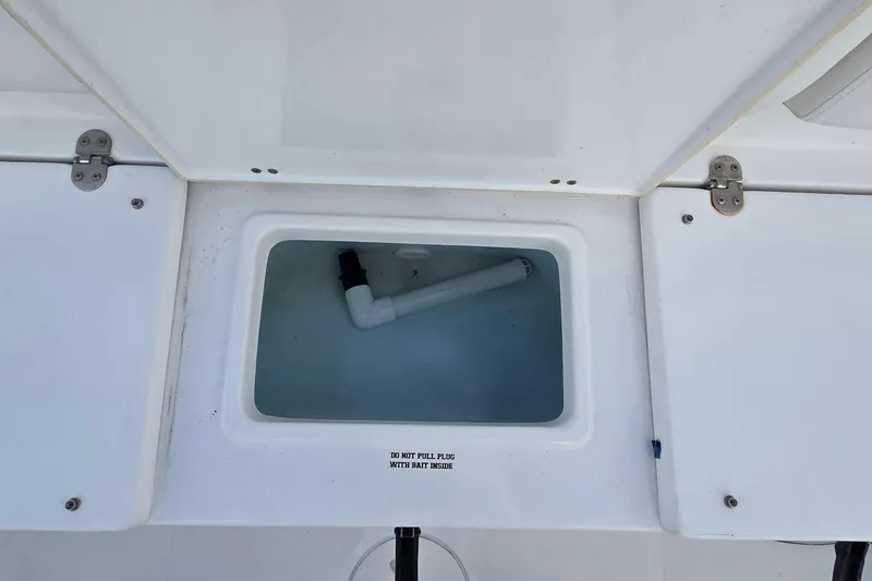 Slide: The Image of Open storage compartment on a 2017 Sea Hunt Ultra 225 boat. - 8