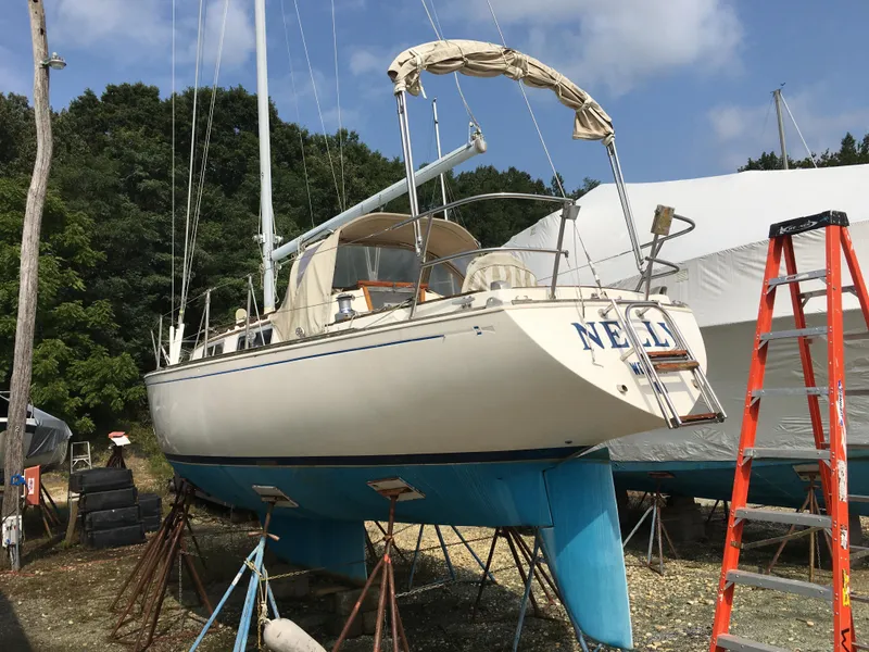 Slide: The Image of 1980 Sabre 34 MK II sailboat on stands outdoors. - 2