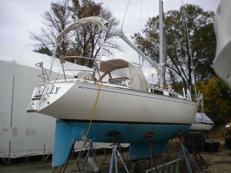 Slide: The Image of 1980 Sabre 34 MK II sailboat on stands outdoors. - 21