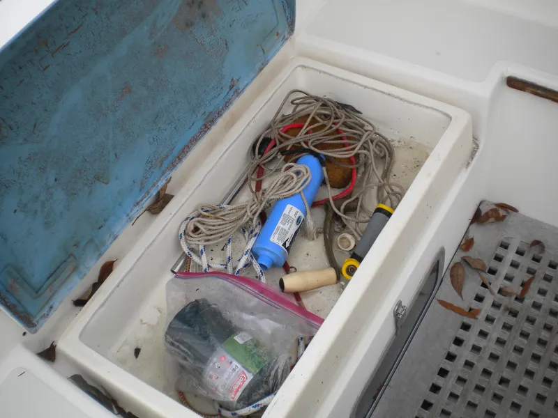 Slide: The Image of Storage compartment on Sabre 34 MK II with ropes and tools. - 24