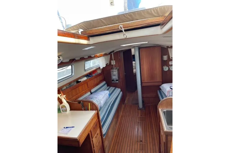Slide: The Image of Interior of 1980 Sabre 34 MK II sailboat with wood finish and cozy seating. - 34