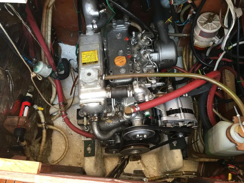 Slide: The Image of Engine compartment of a 1980 Sabre 34 MK II with visible hoses and components. - 48