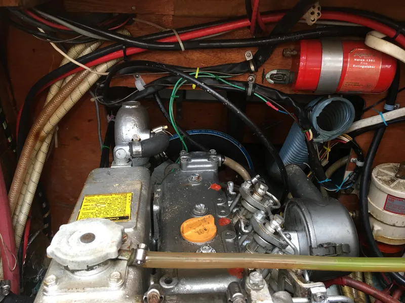 Slide: The Image of Engine compartment of a 1980 Sabre 34 MK II with wires and hoses. - 49