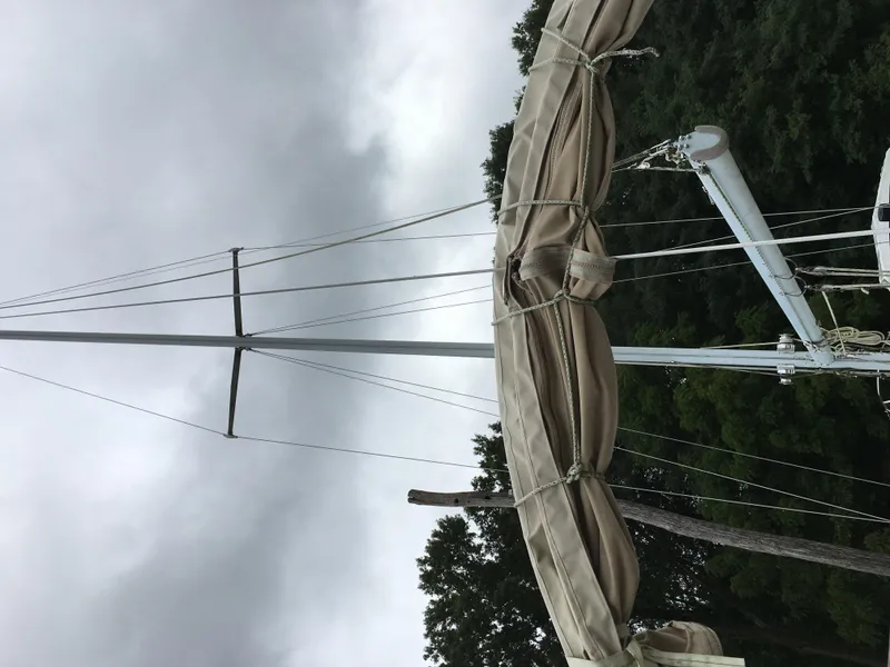 Slide: The Image of Sail mast of 1980 Sabre 34 MK II against cloudy sky. - 5