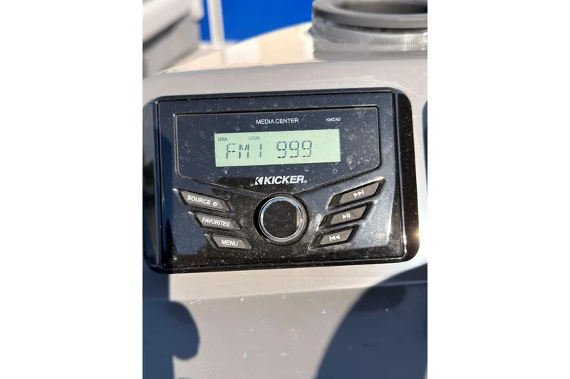 Slide: The Image of Kicker media center display in 2024 Bennington SVL boat, showing FM 99.9 station. - 15