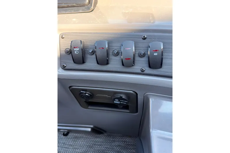 Slide: The Image of 2024 Bennington SVL dashboard switches and controls close-up. - 17