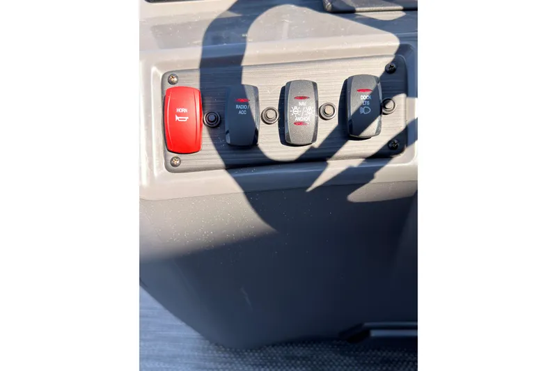 Slide: The Image of 2024 Bennington SVL control panel with horn and accessory switches. - 22