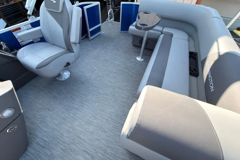 Slide: The Image of 2024 Bennington SVL boat interior with gray seating and modern design. - 4