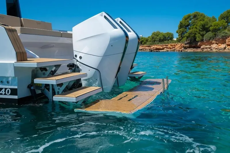 Slide: The Image of Tesoro 40 boat 2026 with engines and swim platform in clear water. - 10