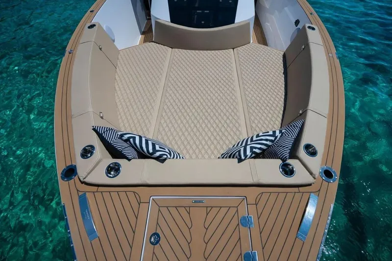 Slide: The Image of Tesoro 40 boat 2026 with luxurious deck on clear water. - 12