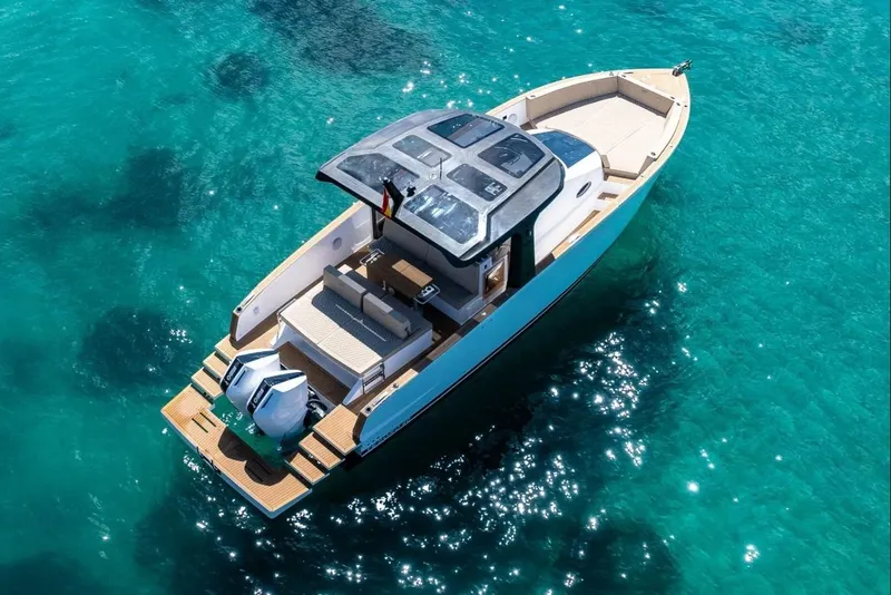 Slide: The Image of Tesoro 40 Yacht 2026 on clear turquoise water. - 3