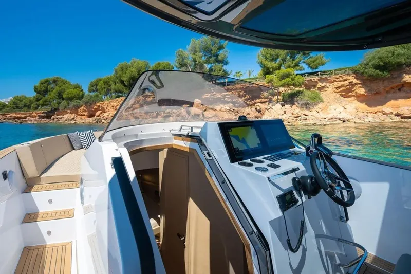 Slide: The Image of Tesoro 40 Yacht 2026 with modern cockpit and coastal view. - 17